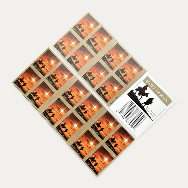 Photograph of a Holy Family Forever stamp booklet showing both sides and the booklet cover