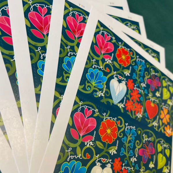 Garden of Love stamp sheets shown in a fan