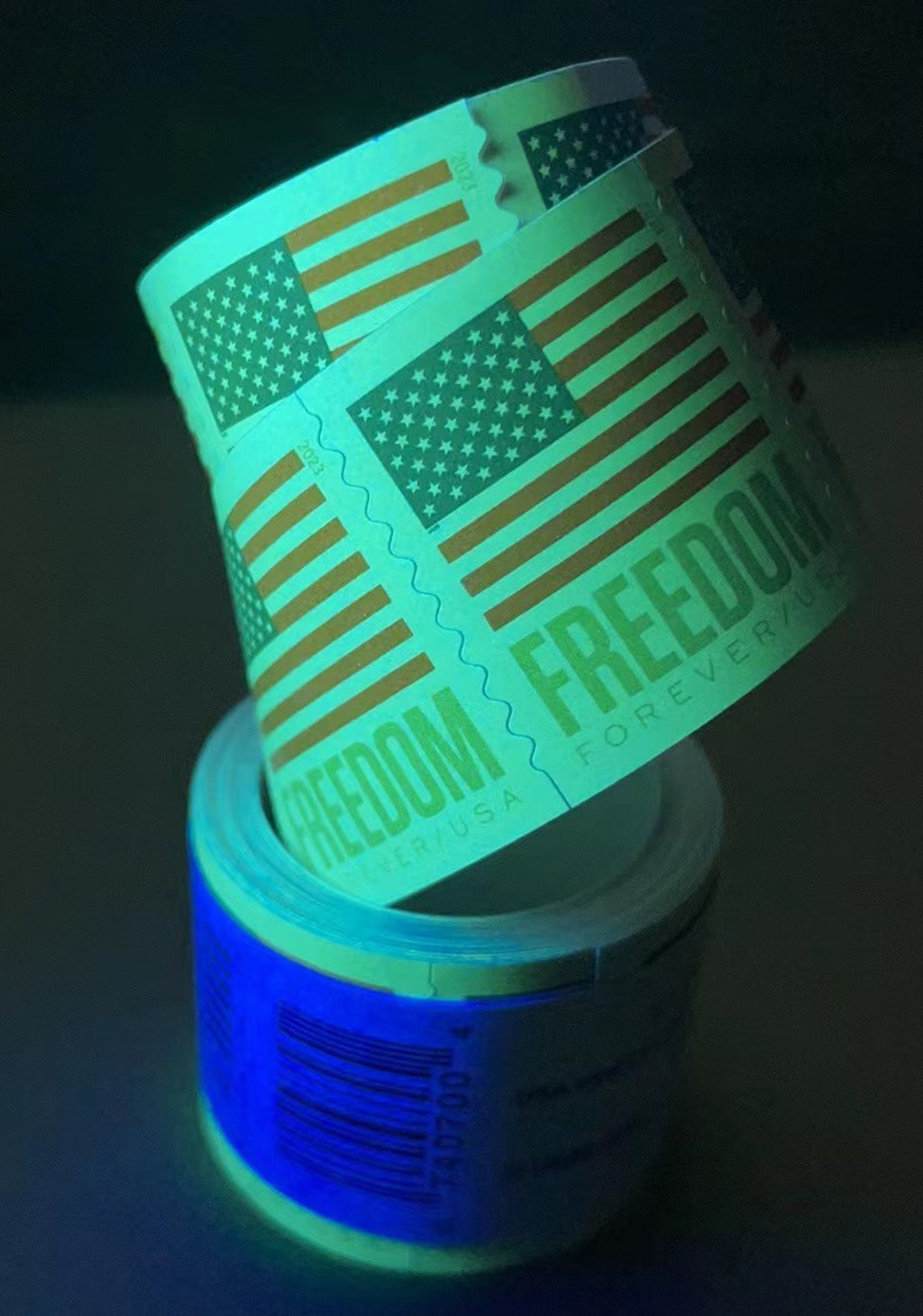 2023 U.S. Flag Freedom stamp roll under ultraviolet light
