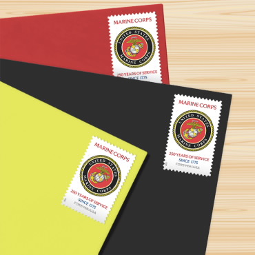 Three Marine Corps anniversary stamps on colored envelopes